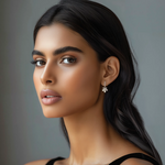 Load image into Gallery viewer, A woman wearing silver floral earrings.