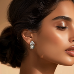Load image into Gallery viewer, A person wearing a pair of silver pearl earrings.