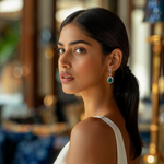 Load image into Gallery viewer, A woman wearing a white dress showcasing silver earrings with green stones.