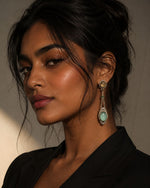 Load image into Gallery viewer, Woman wearing elegant earrings with a neutral background