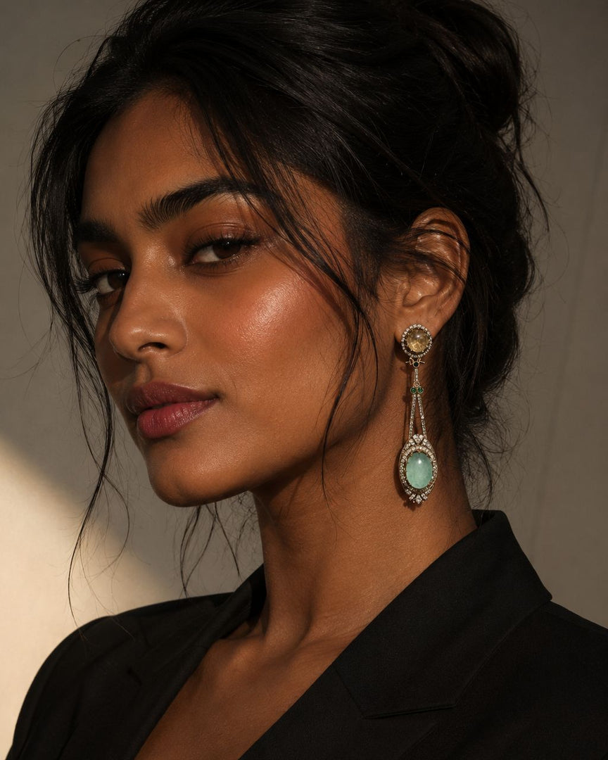 Woman wearing elegant earrings with a neutral background