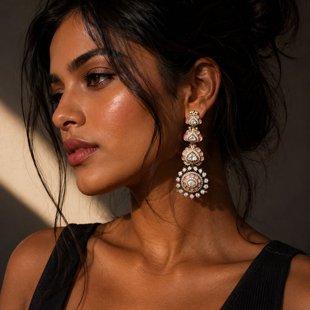 Woman wearing elegant earrings with a neutral background