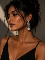 Woman wearing a black top with a blurred background