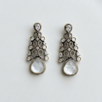 Load image into Gallery viewer, Pair of ornate earrings with clear stones on a white background