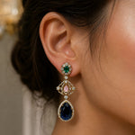 Load image into Gallery viewer, Close-up of a person wearing a sparkling earring with gemstones.