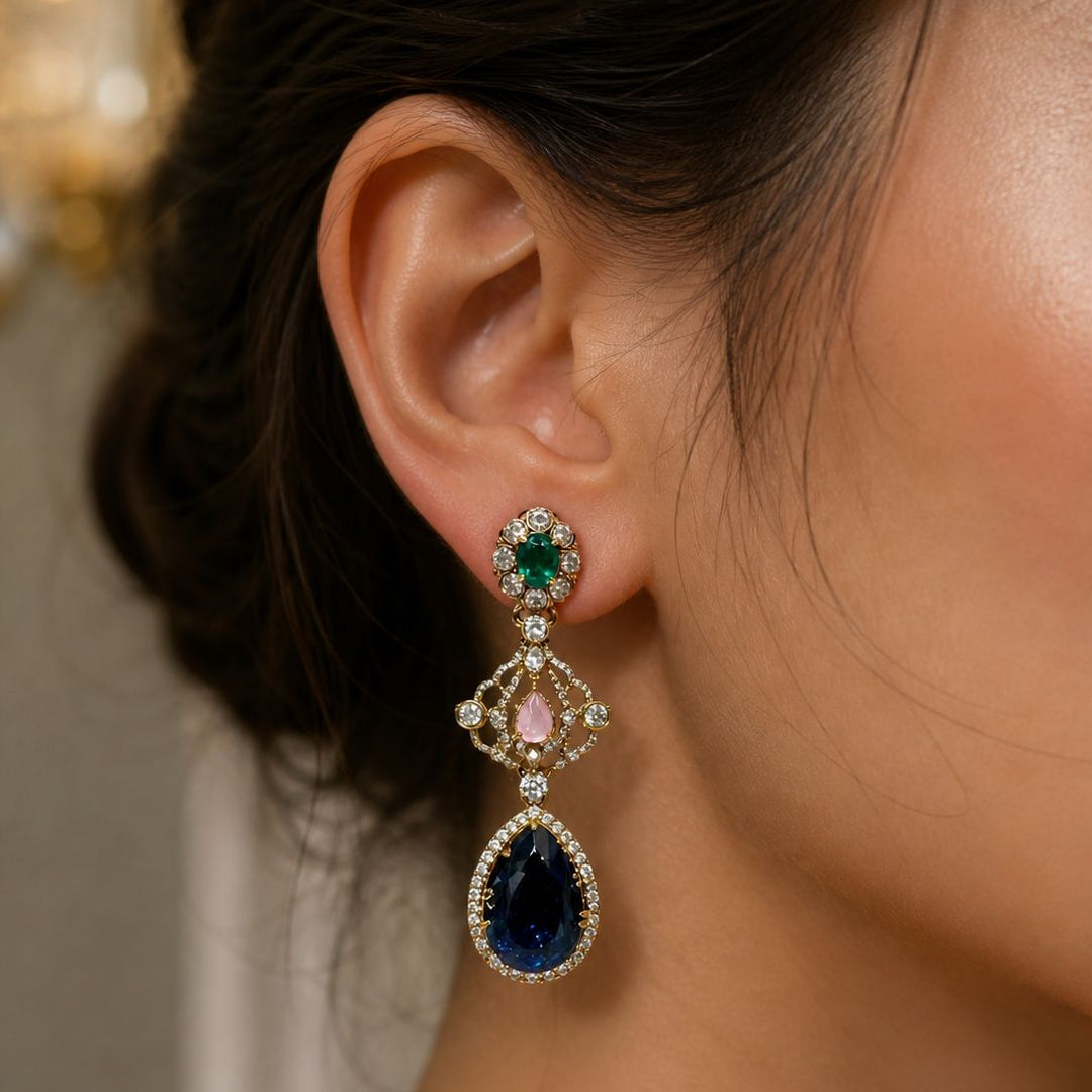 Close-up of a person wearing a sparkling earring with gemstones.