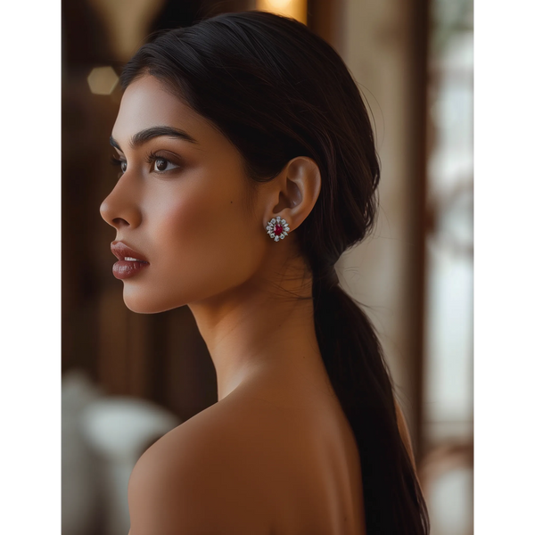 A person viewed from the side wearing the Crimson Rhapsody Ruby Silver Studs earrings.